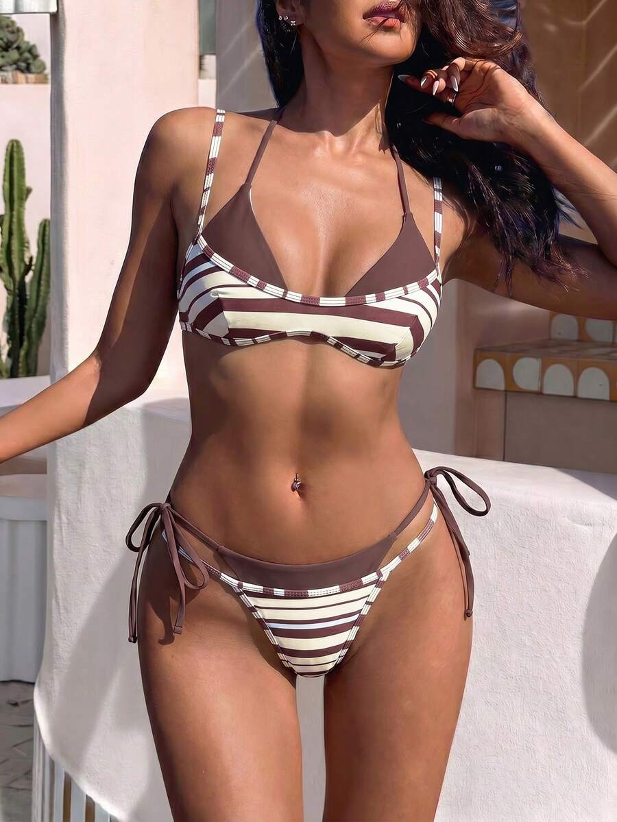 Women's retro polka dot high waist bikini swimsuit set with spaghetti straps and knot tie-back top.