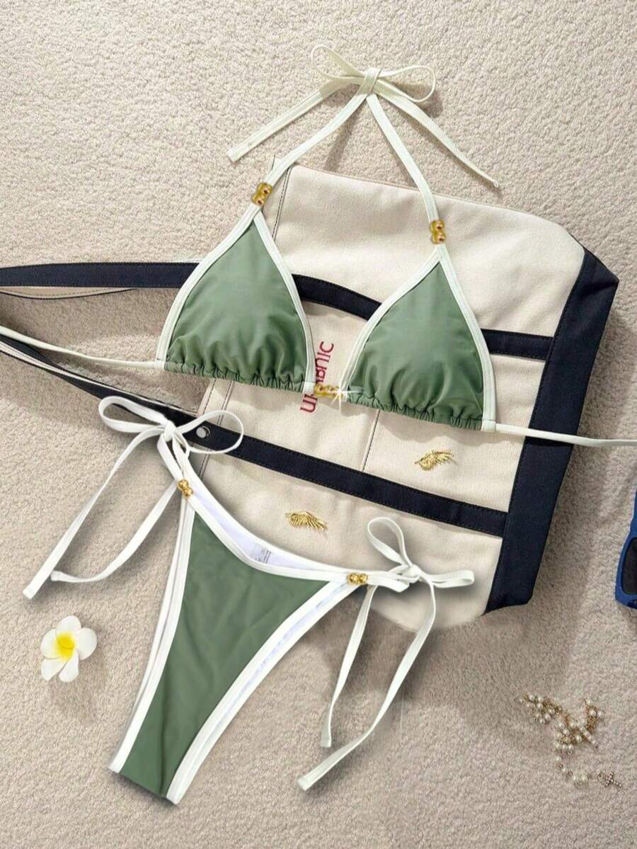 Women's black halter bikini set featuring triangle cups with gold bead decor and tie-back closure