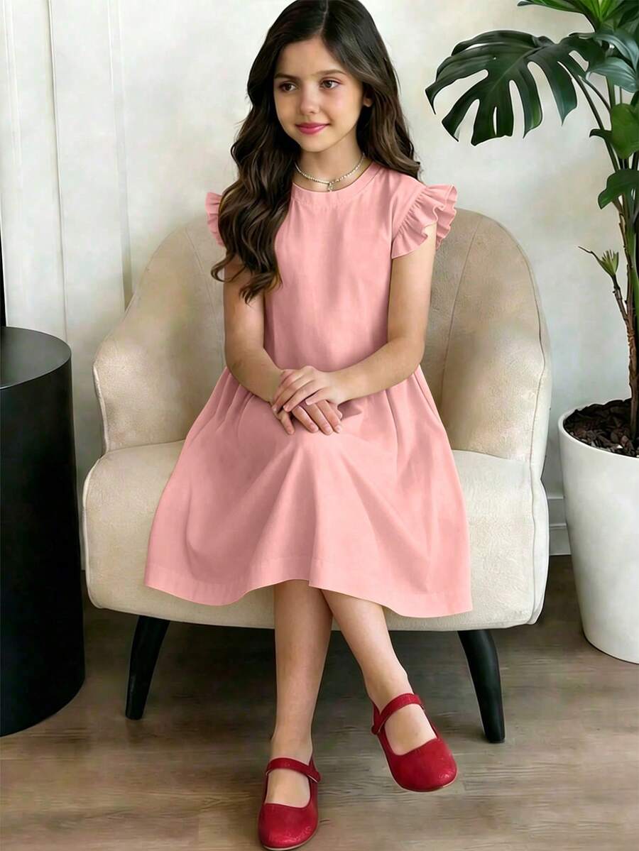 Girls black ruffle sleeve midi dress featuring a loose fit tunic silhouette, round neckline, button details, and short flounce sleeves.