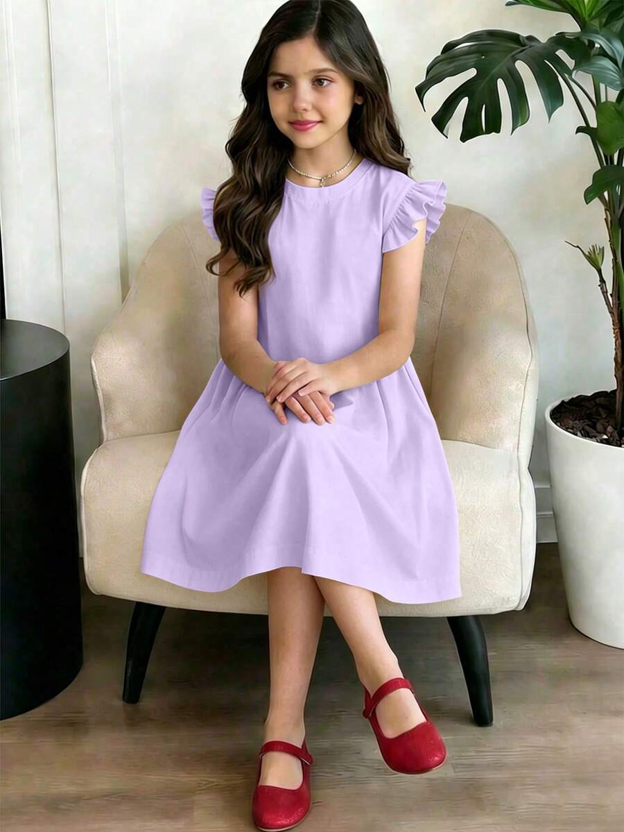 Girls black ruffle sleeve midi dress featuring a loose fit tunic silhouette, round neckline, button details, and short flounce sleeves.