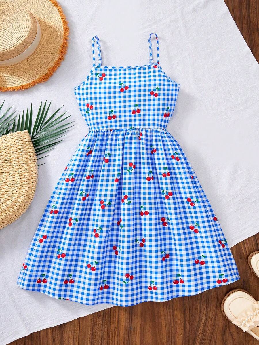 Tween girl wearing an apricot floral print sleeveless mini cami dress featuring spaghetti straps, a shirred high waist, flounce hem, and a bow back detail.