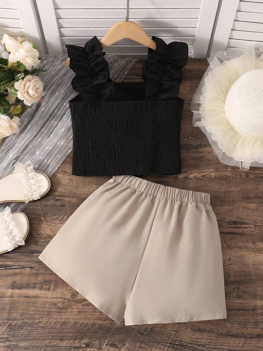 Apricot two-piece summer outfit for tween girls featuring a sleeveless pleated square-neck camisole top with button details and matching gathered shorts.