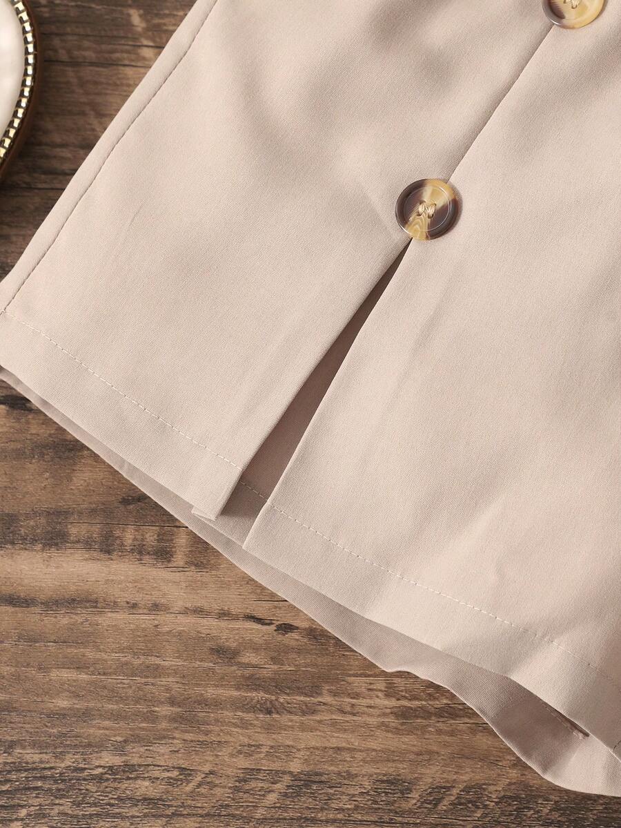 Apricot two-piece summer outfit for tween girls featuring a sleeveless pleated square-neck camisole top with button details and matching gathered shorts.