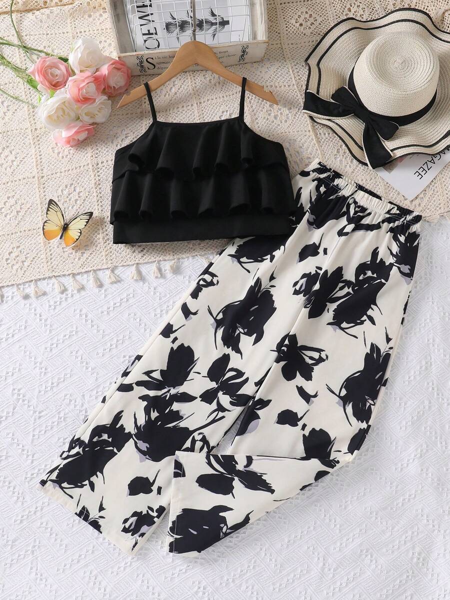 Tween girls blue 2-piece vacation outfit set featuring a tiered ruffle spaghetti strap camisole and loose high-waist pants.