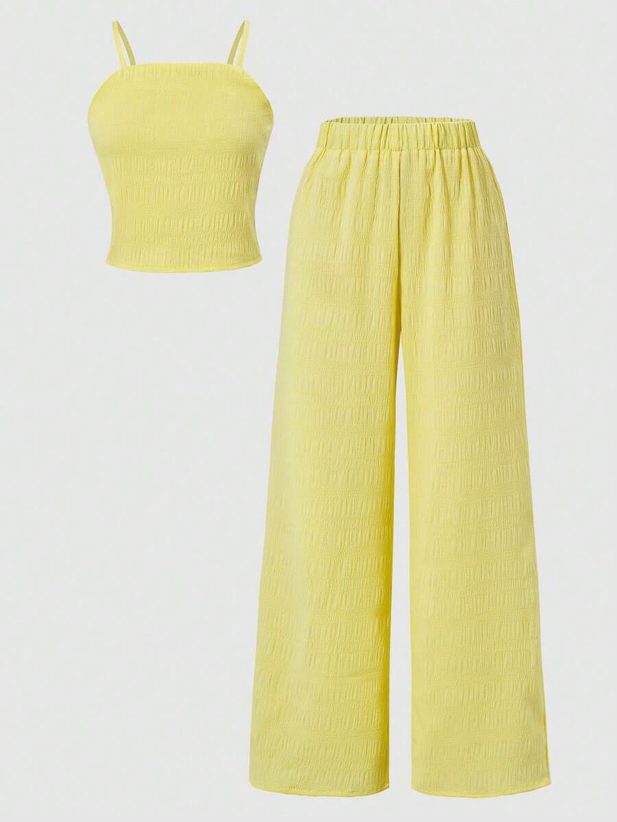 Tween girls casual 2-piece set featuring an apricot woven camisole crop top with back shirring and matching high-waisted loose long pants.