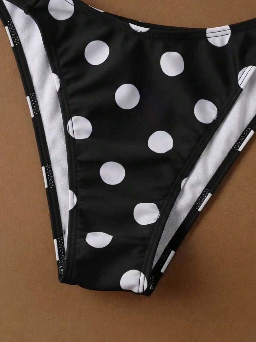 Women's halter neck bikini swimwear set featuring a wireless bra top with removable padding and mid waist bikini bottom.