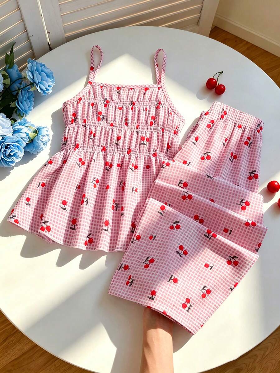 Girls 2-piece summer outfit set featuring a blue bow print camisole top with spaghetti straps and matching high-waisted straight leg pants.