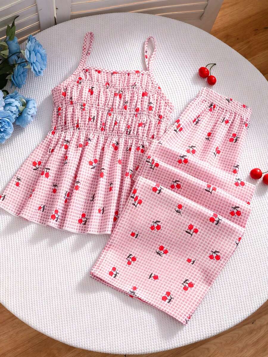 Girls 2-piece summer outfit set featuring a blue bow print camisole top with spaghetti straps and matching high-waisted straight leg pants.