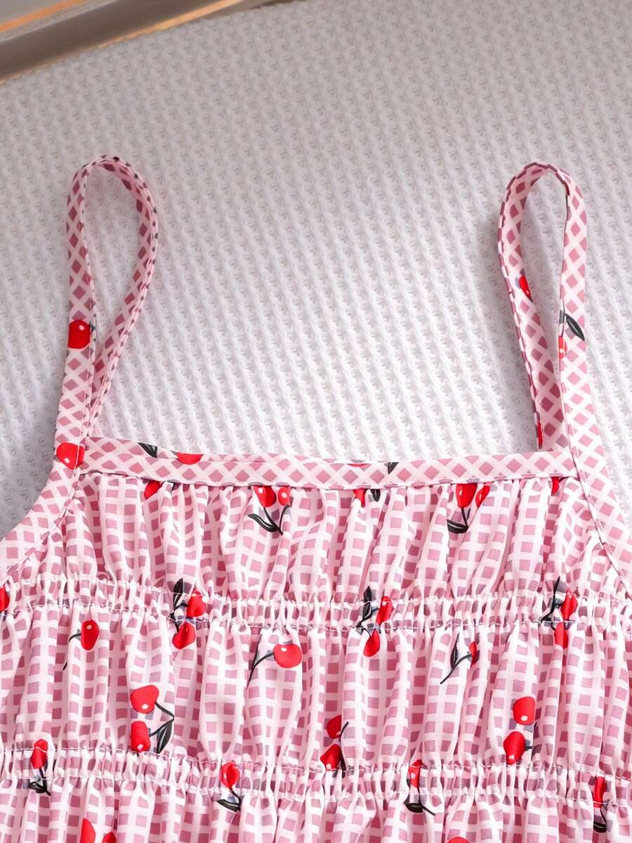 Girls 2-piece summer outfit set featuring a blue bow print camisole top with spaghetti straps and matching high-waisted straight leg pants.
