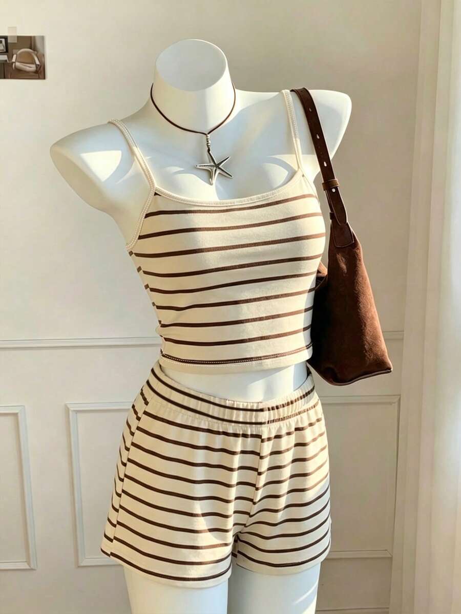 Tween girls summer 2-piece Hawaiian style outfit featuring a graphic print spaghetti strap camisole top with contrast piping and matching casual shorts.