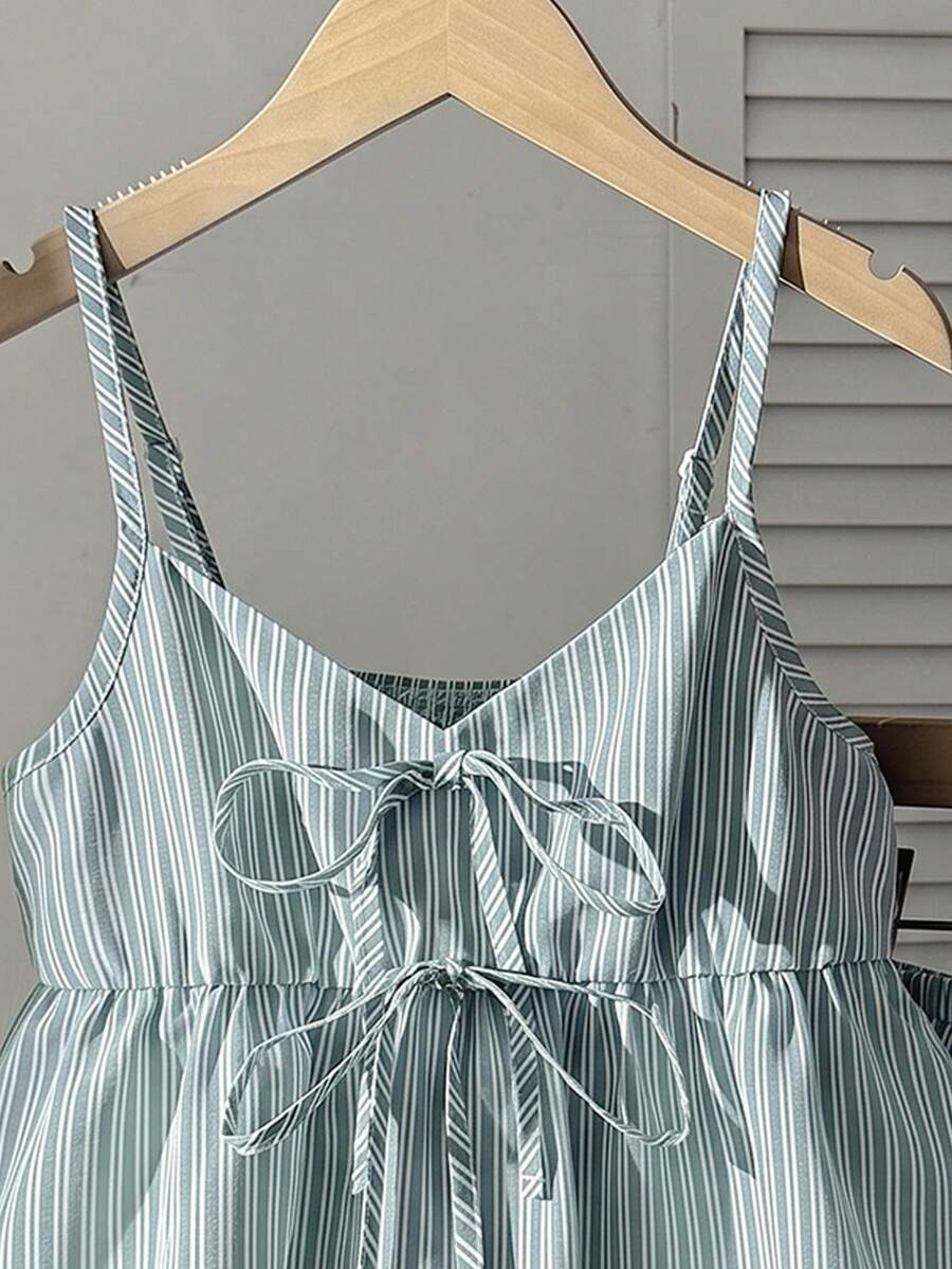 Tween girl 2-piece summer set with a black and white sleeveless striped spaghetti strap tank top with ruffle details and matching casual shorts.