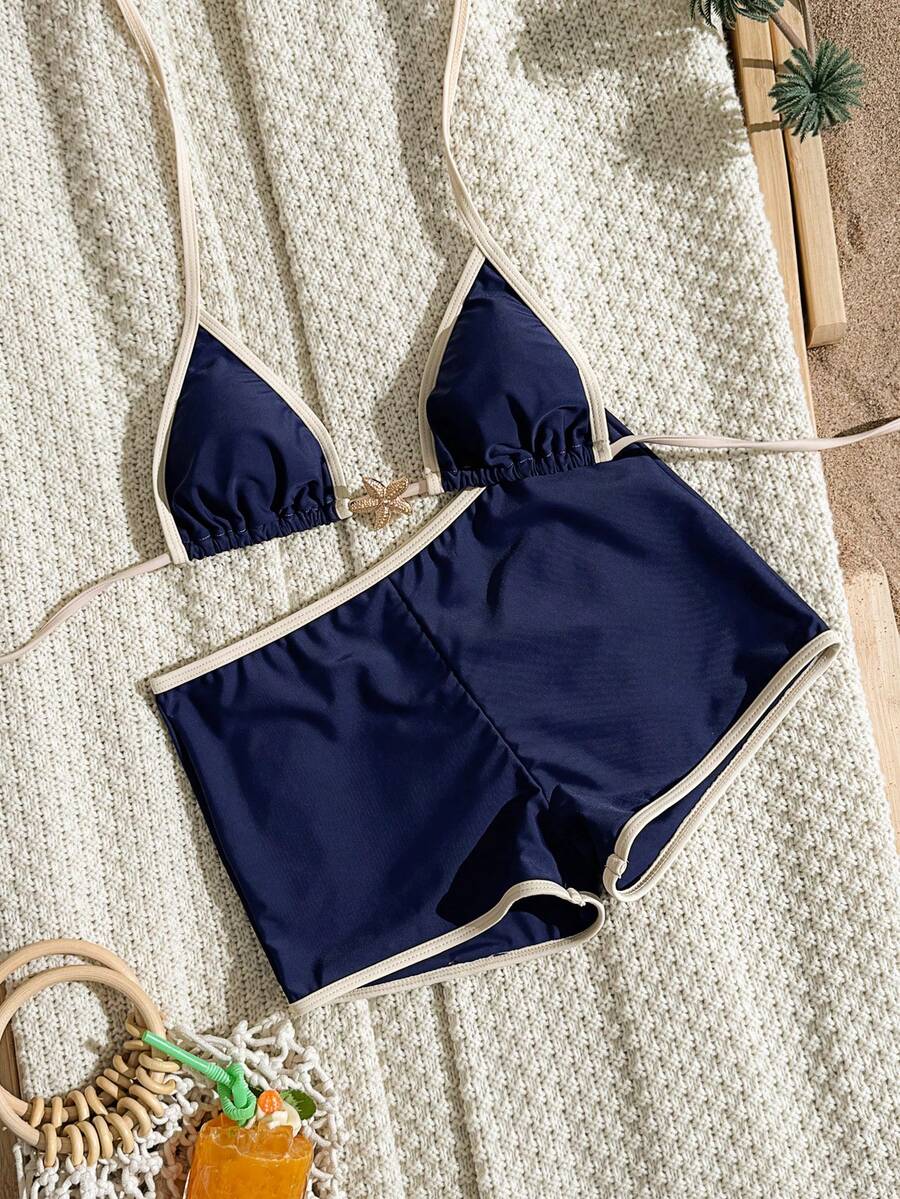 Women's apricot two-piece swimsuit set with a halter tie-back top and matching high stretch shorts.