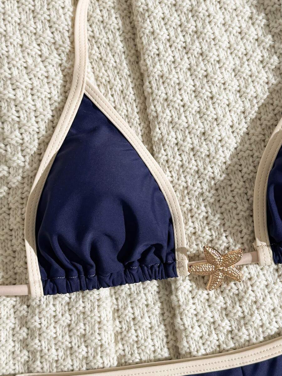 Women's apricot two-piece swimsuit set with a halter tie-back top and matching high stretch shorts.
