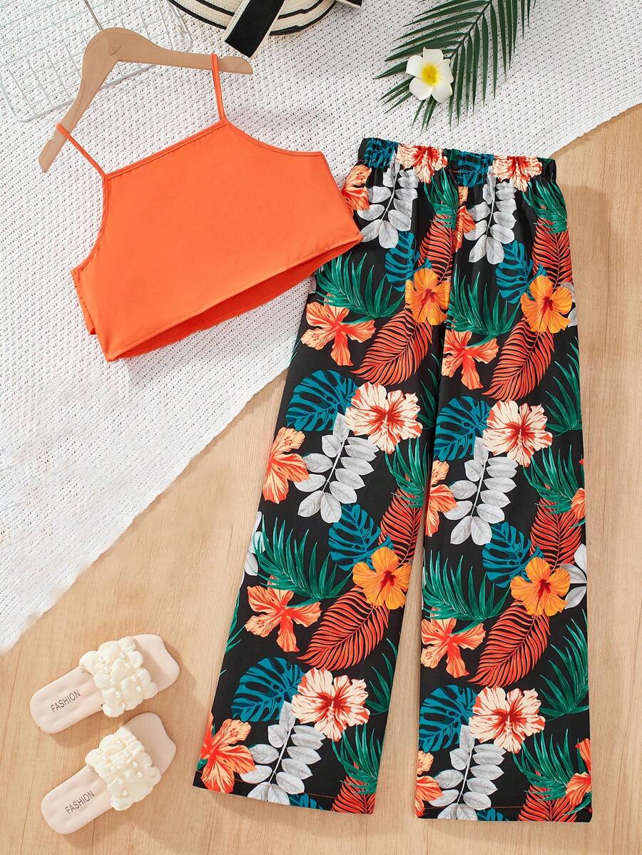 Tween girls blue 2-piece vacation outfit set featuring a tiered ruffle spaghetti strap camisole and loose high-waist pants.
