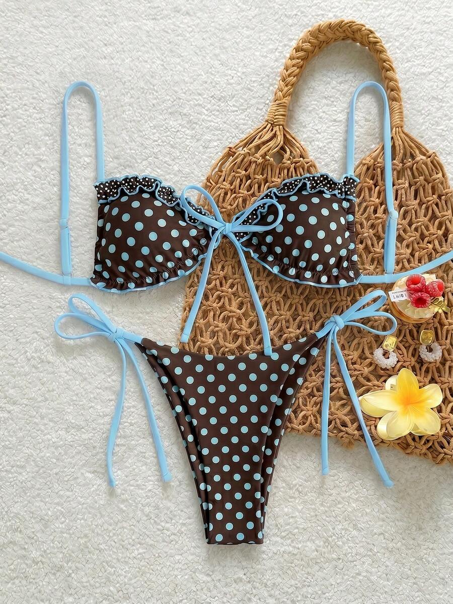 Women's beige two-piece bikini set featuring a wireless top with removable padding, spaghetti straps, tie back detail, and low waist hipster swimsuit bottoms.