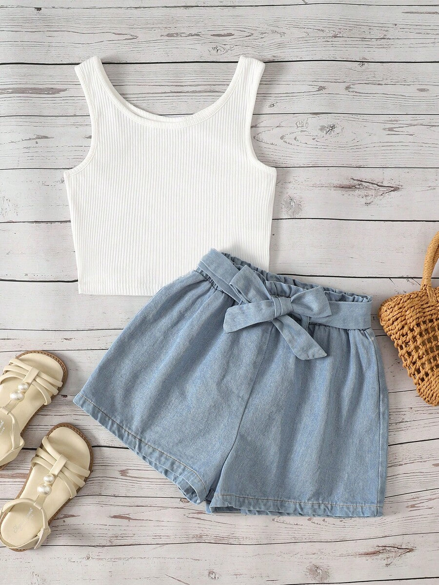 Tween girl wearing a casual 2-piece set featuring a black rib-knit scoop neck tank top and leopard print paperbag waist shorts with a matching belt.