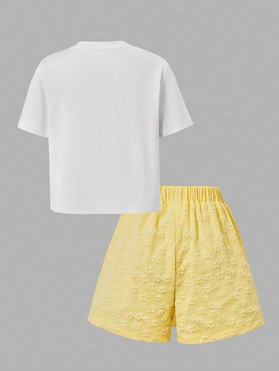 Tween girls 2-piece blue outfit featuring a short sleeve round neck t-shirt with a bow front detail and an asymmetric wrap skort.