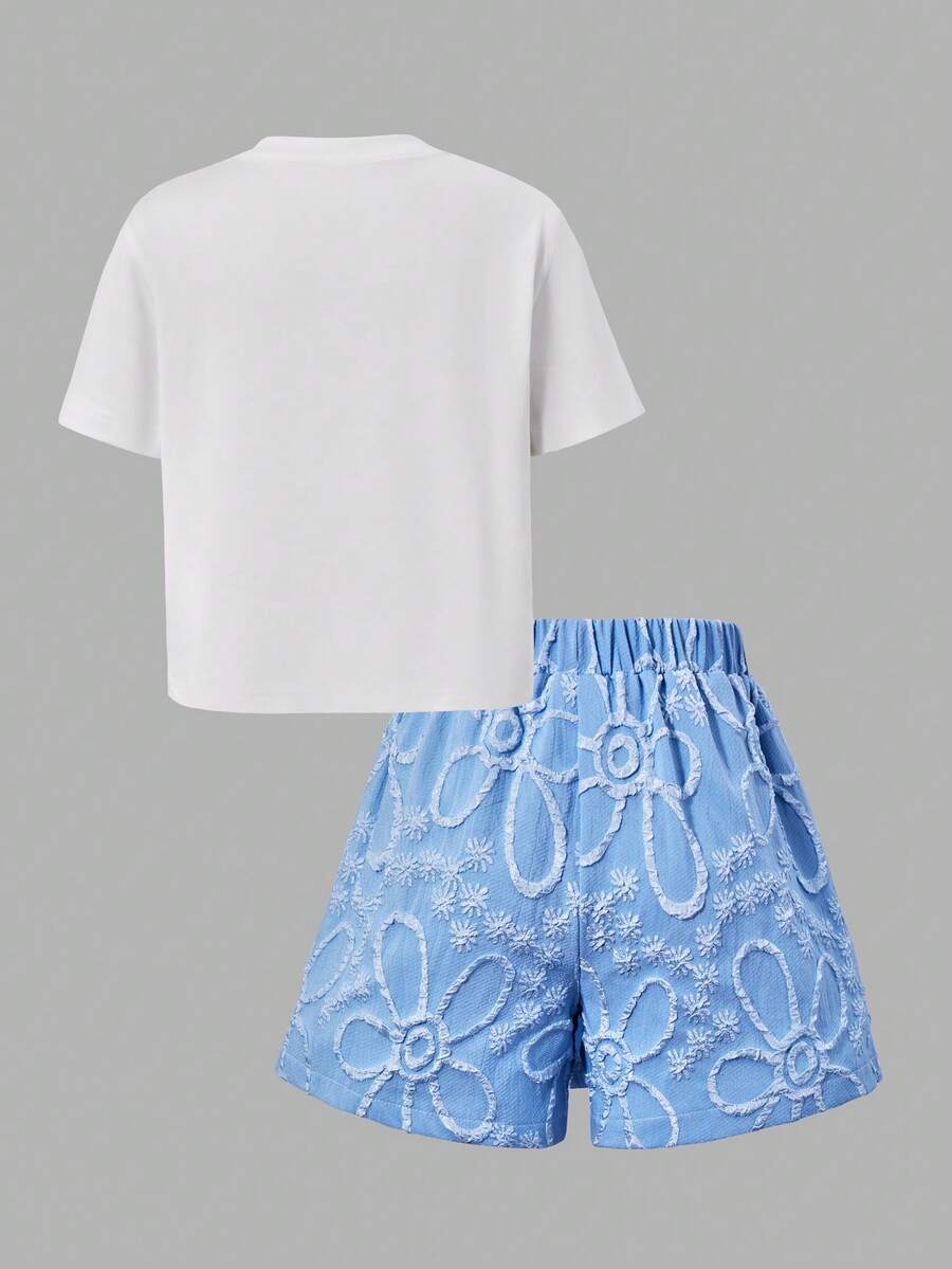 Tween girls 2-piece blue outfit featuring a short sleeve round neck t-shirt with a bow front detail and an asymmetric wrap skort.