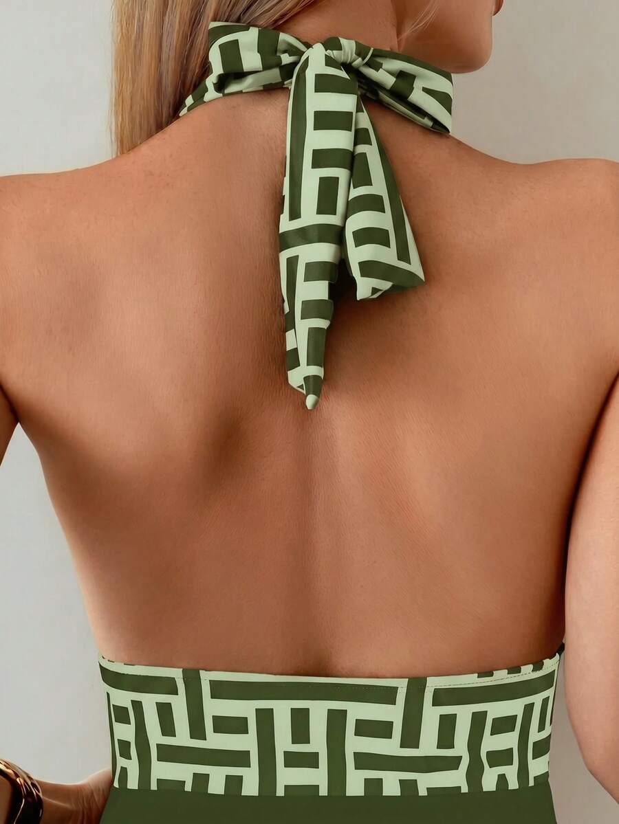 Apricot women's one-piece swimsuit featuring a halter neckline, backless tie-back detail, and ruched knitted fabric.
