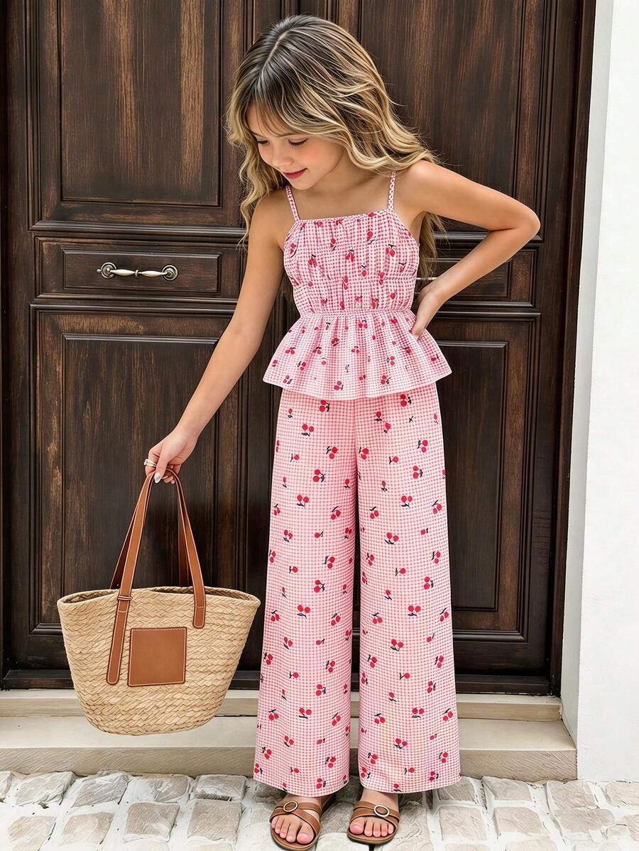 Girls 2-piece summer outfit set featuring a blue bow print camisole top with spaghetti straps and matching high-waisted straight leg pants.