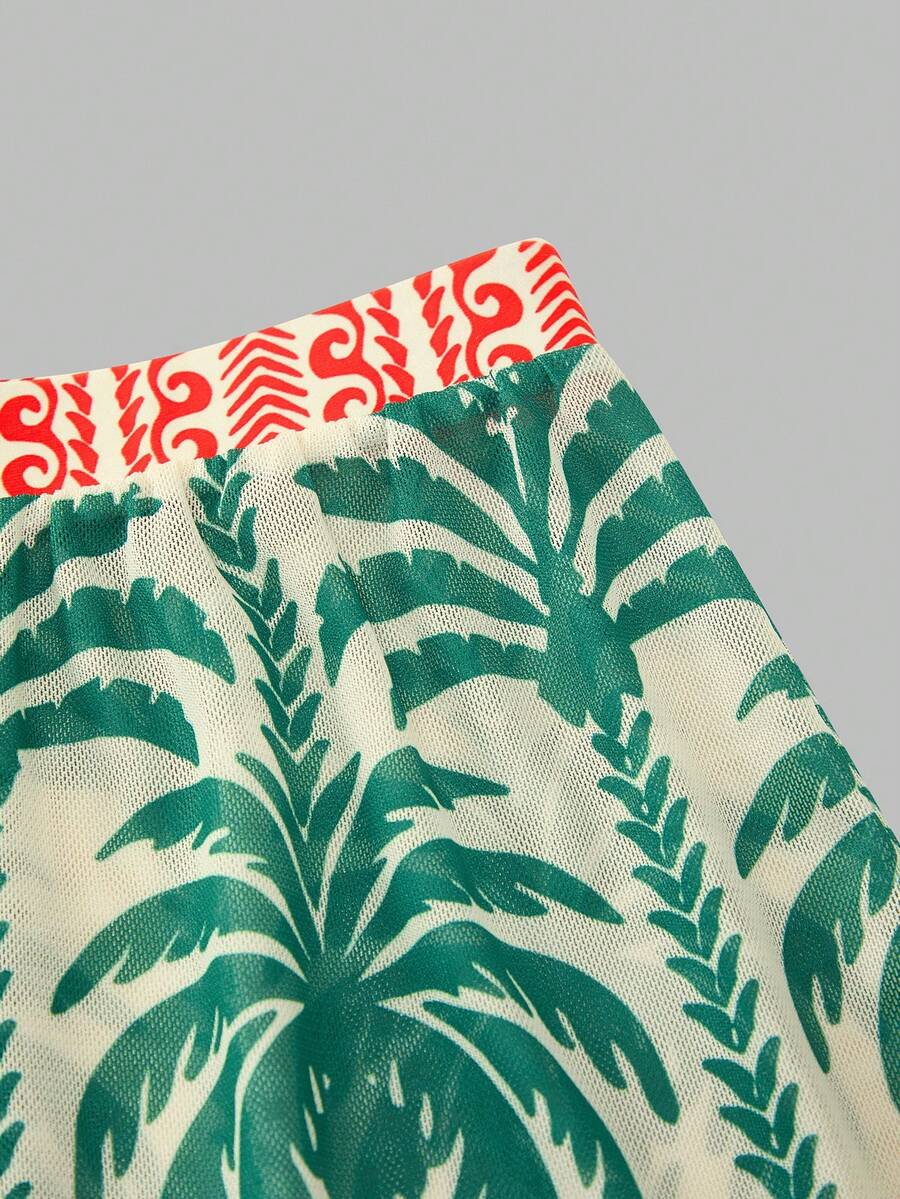 Swim Oasis women's tropical palm tree print army green one-piece swimsuit featuring spaghetti straps, removable padding, and matching shorts for beach vacations.