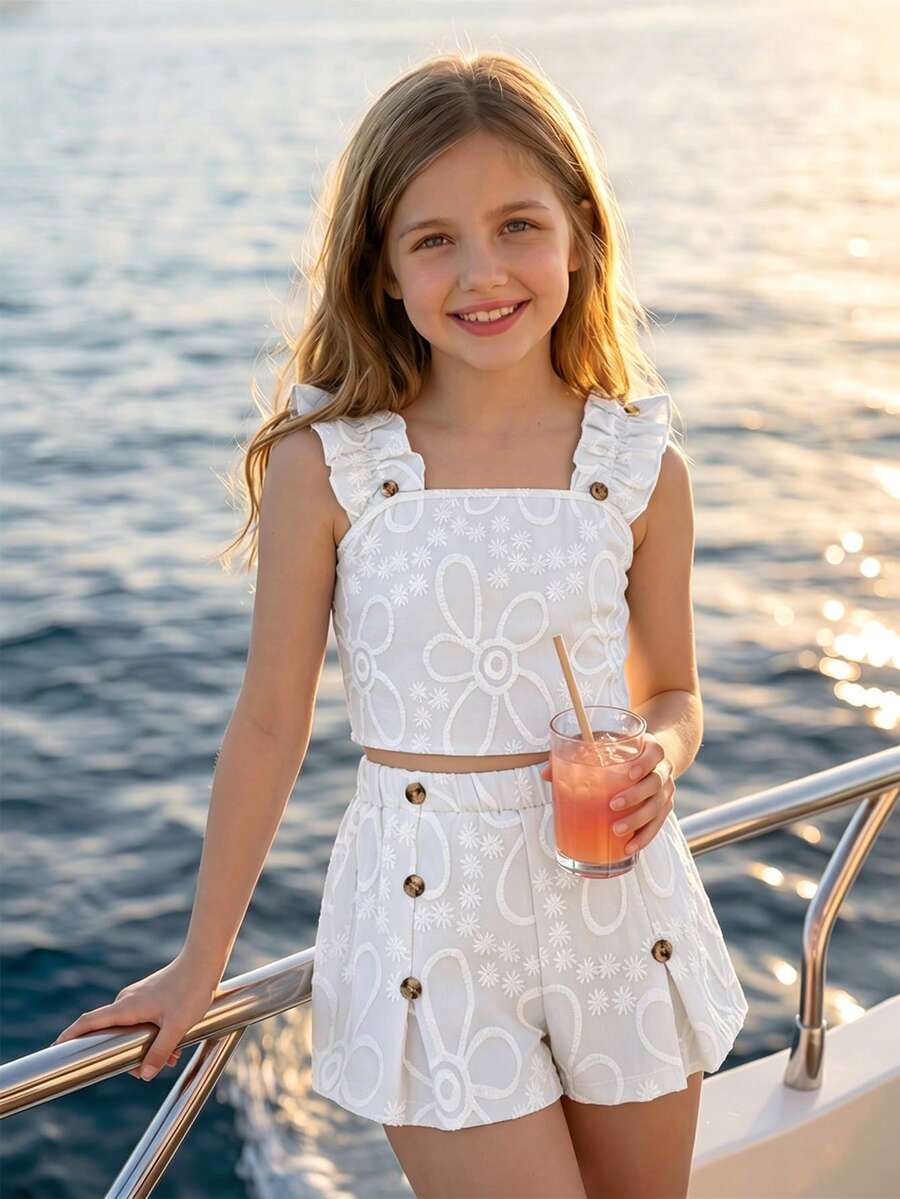 Apricot two-piece summer outfit for tween girls featuring a sleeveless pleated square-neck camisole top with button details and matching gathered shorts.
