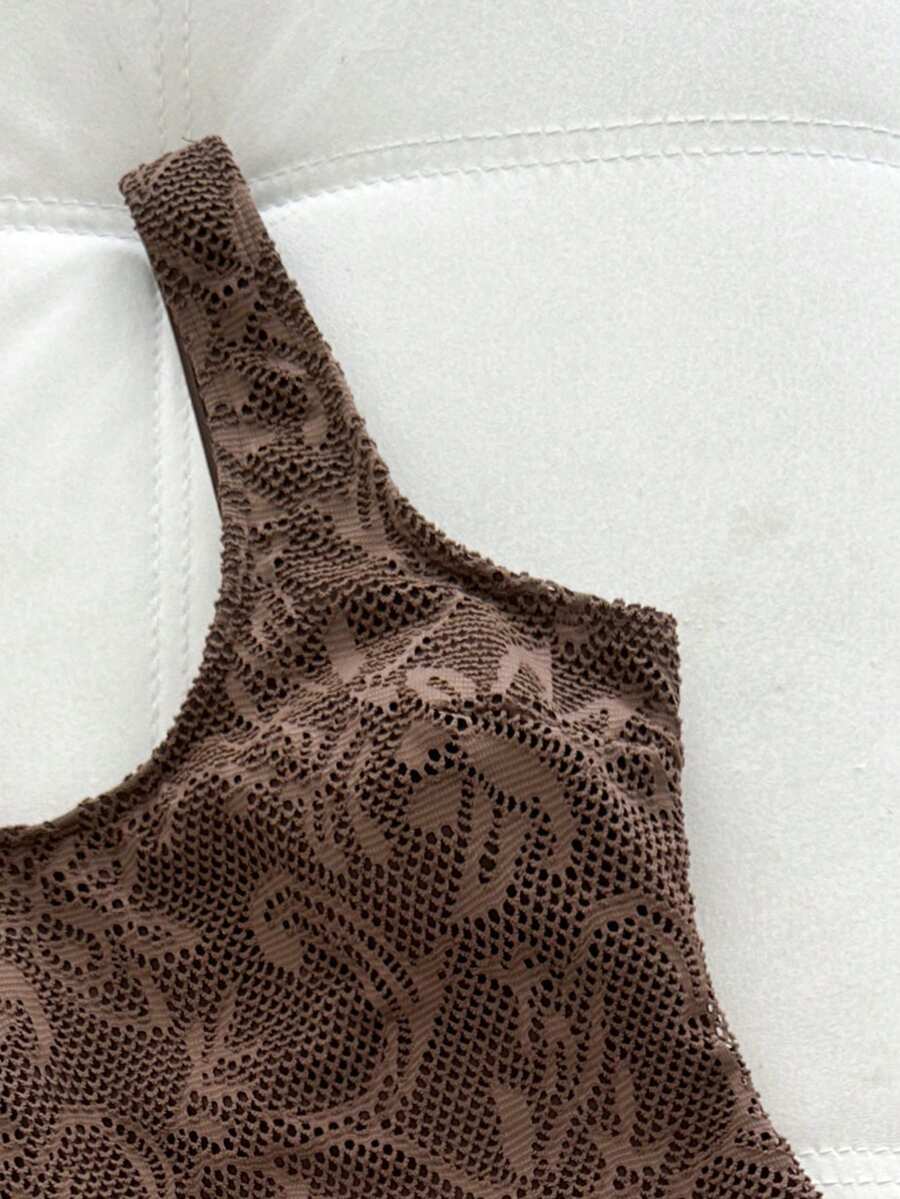 Women's solid color one-piece swimsuit featuring a backless scoop neck design and high cut fit
