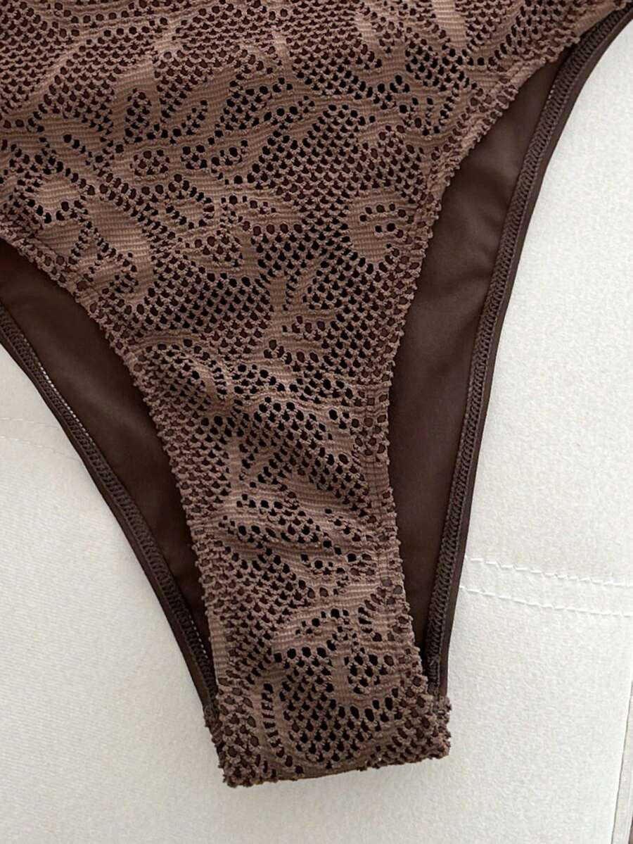 Women's solid color one-piece swimsuit featuring a backless scoop neck design and high cut fit