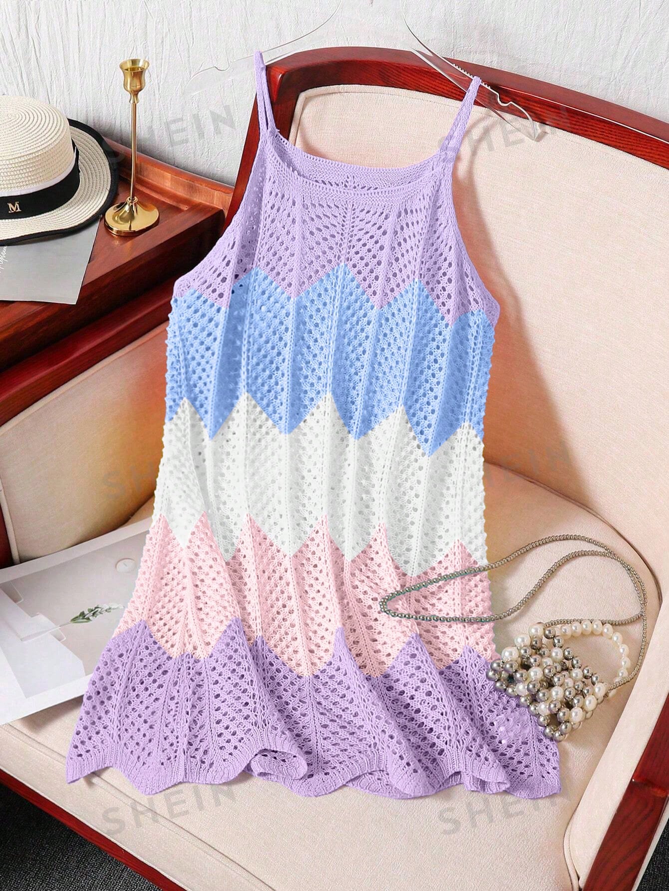 Girls' multicolor rainbow gradient crochet beach cover up with hollow-out knit design, spaghetti straps, sleeveless A-line shape, and semi-sheer finish.
