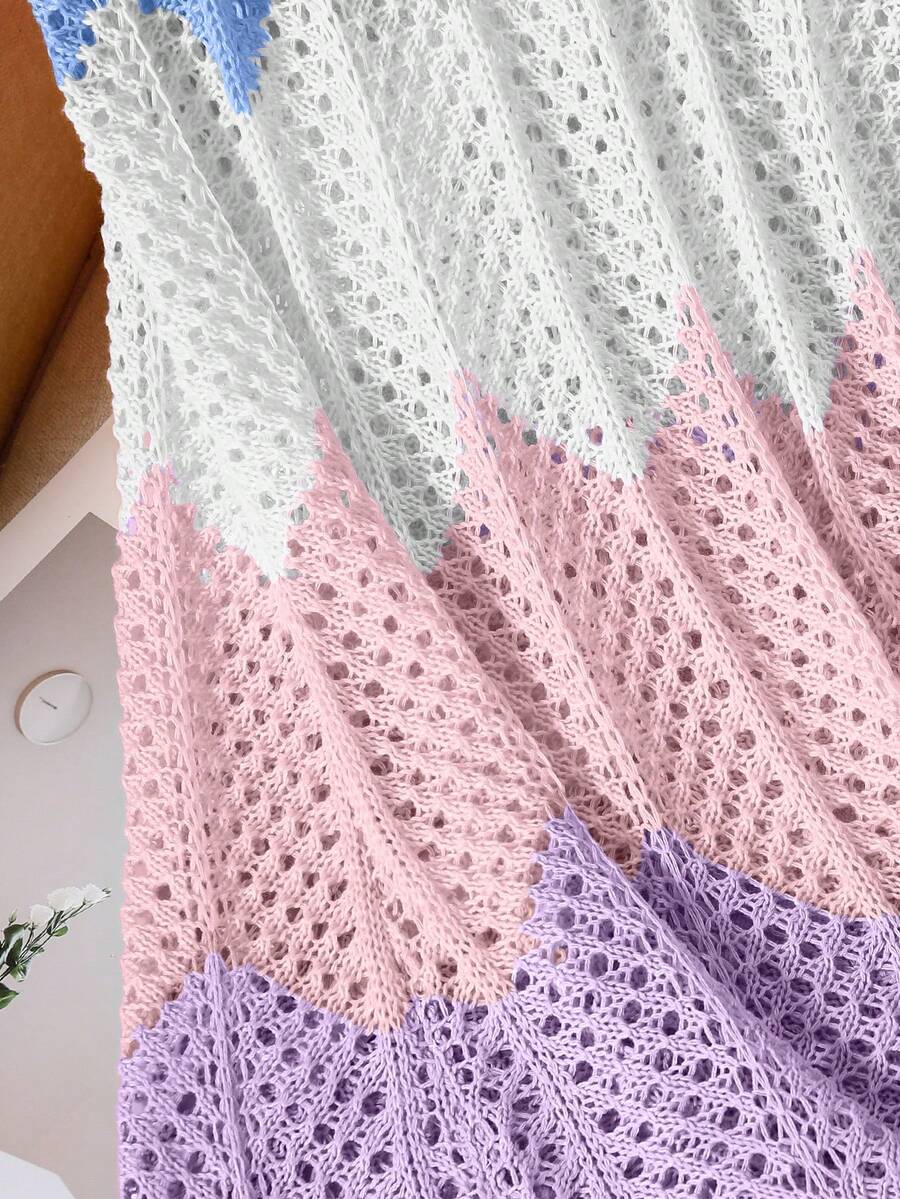 Girls' multicolor rainbow gradient crochet beach cover up with hollow-out knit design, spaghetti straps, sleeveless A-line shape, and semi-sheer finish.