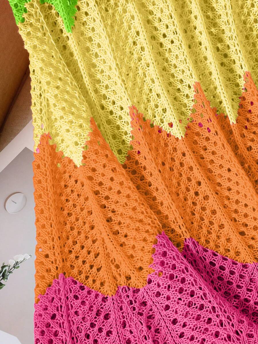 Girls' multicolor rainbow gradient crochet beach cover up with hollow-out knit design, spaghetti straps, sleeveless A-line shape, and semi-sheer finish.