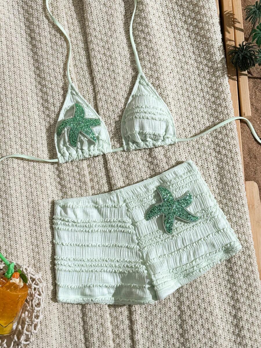 Women's apricot two-piece swimsuit set with a halter tie-back top and matching high stretch shorts.