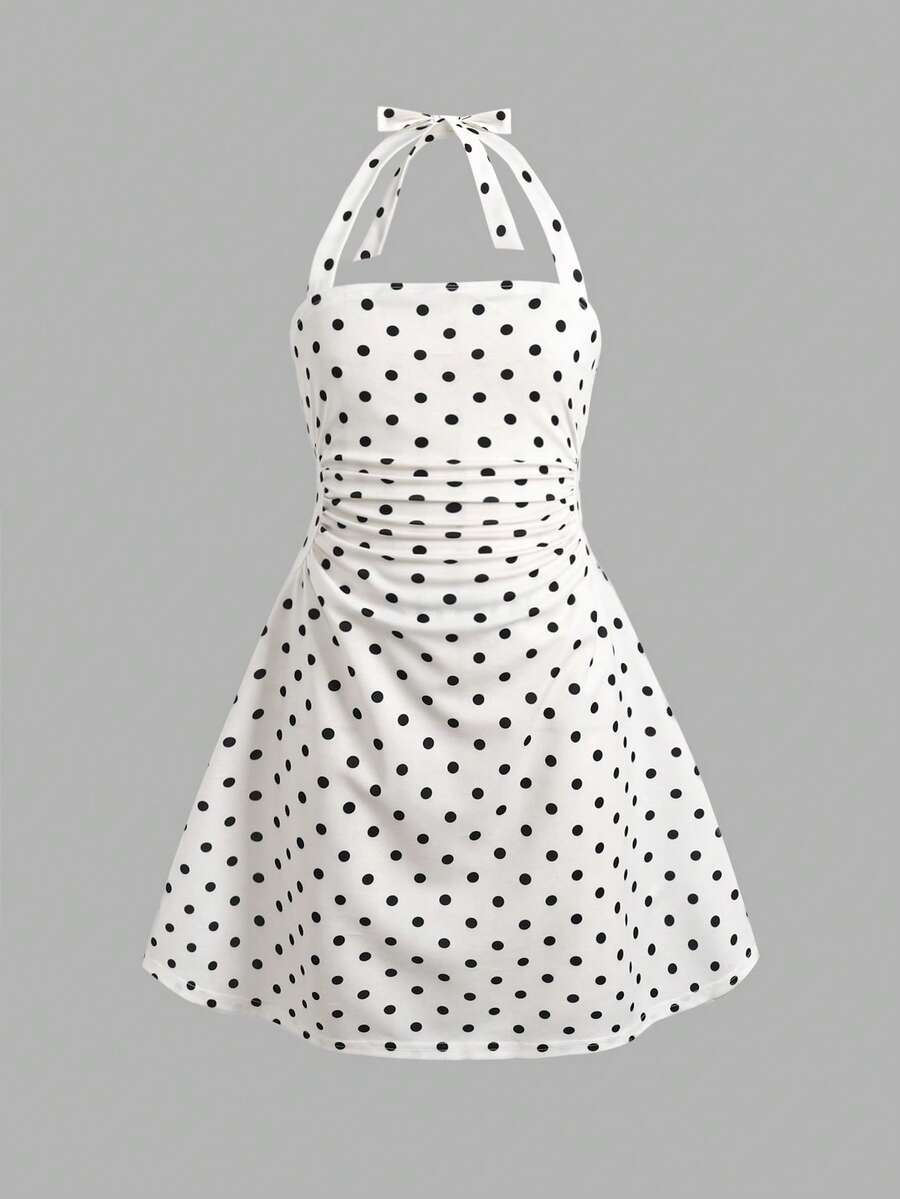 Tween girls blue sleeveless cami dress with spaghetti straps, ruched bust, short slim fit, and vacation-ready style