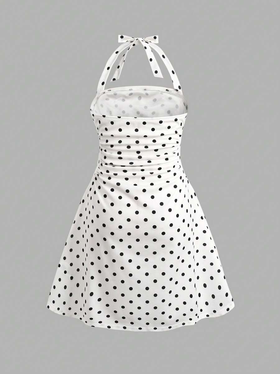 Apricot tween girls sleeveless halter cami dress with appliques, bow front, zipper detail, high waist, flared hem, and short slim fit design.