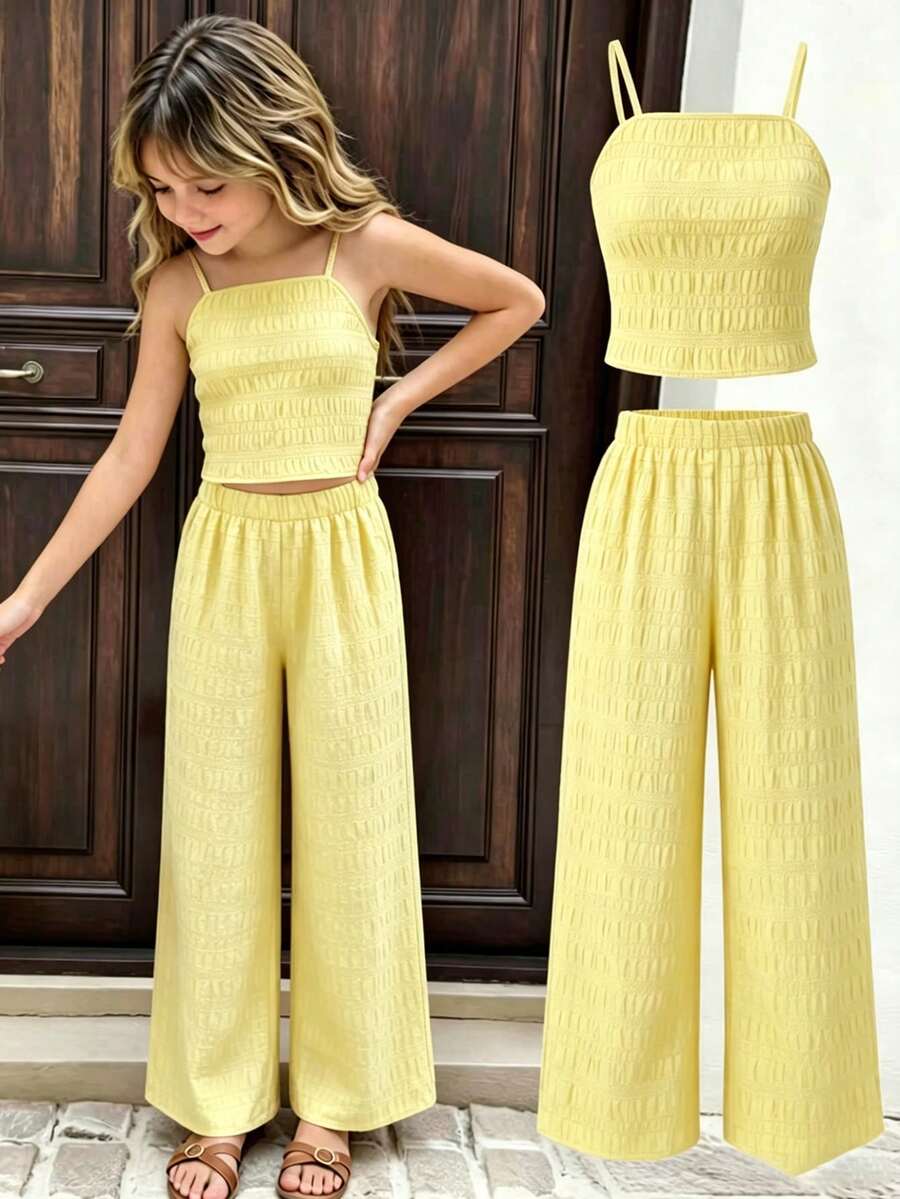 Tween girls casual 2-piece set featuring an apricot woven camisole crop top with back shirring and matching high-waisted loose long pants.
