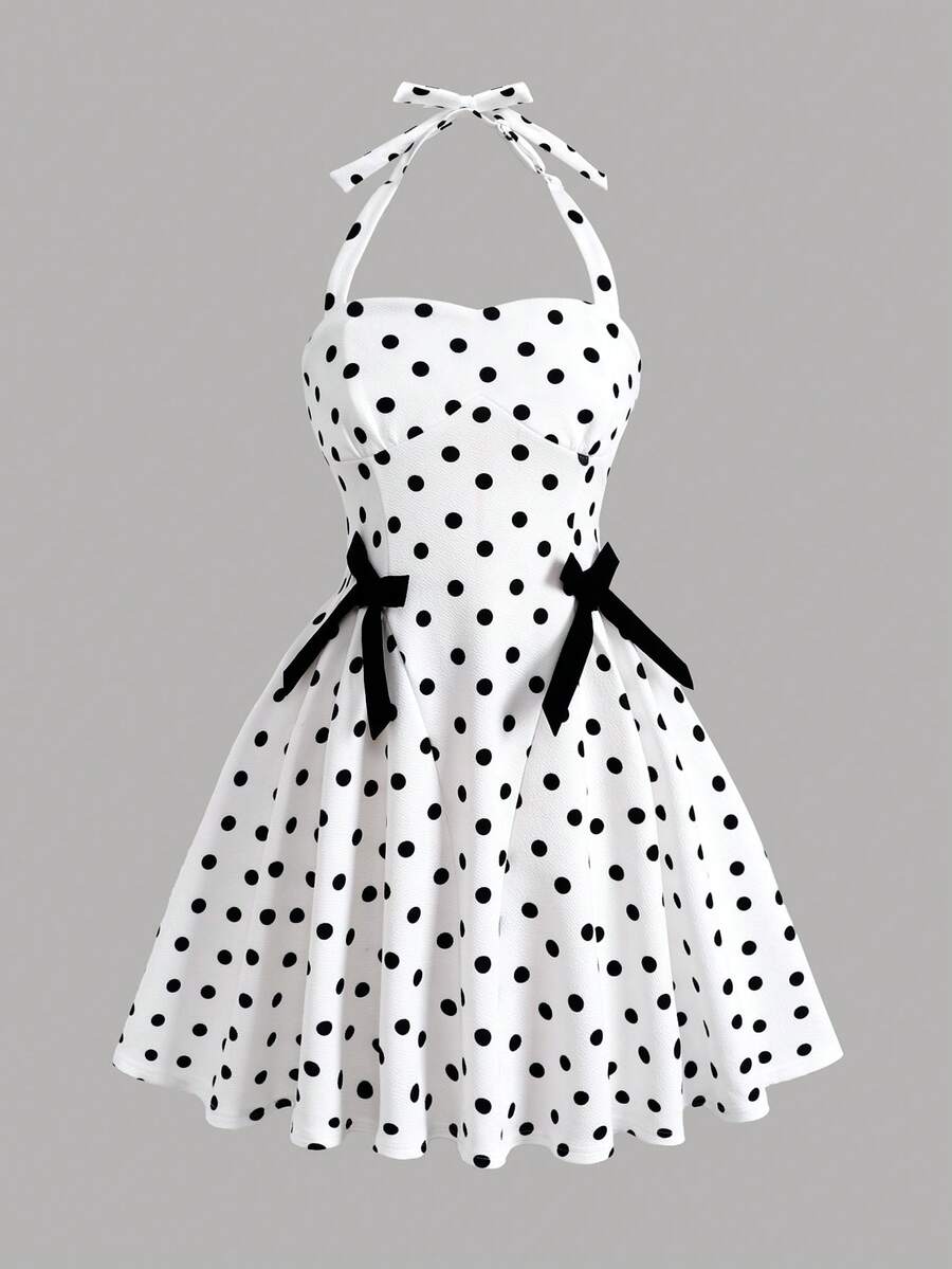 Black and white polka dot cami dress for tween girls featuring a square neckline, high waist, and flared short A-line hem.