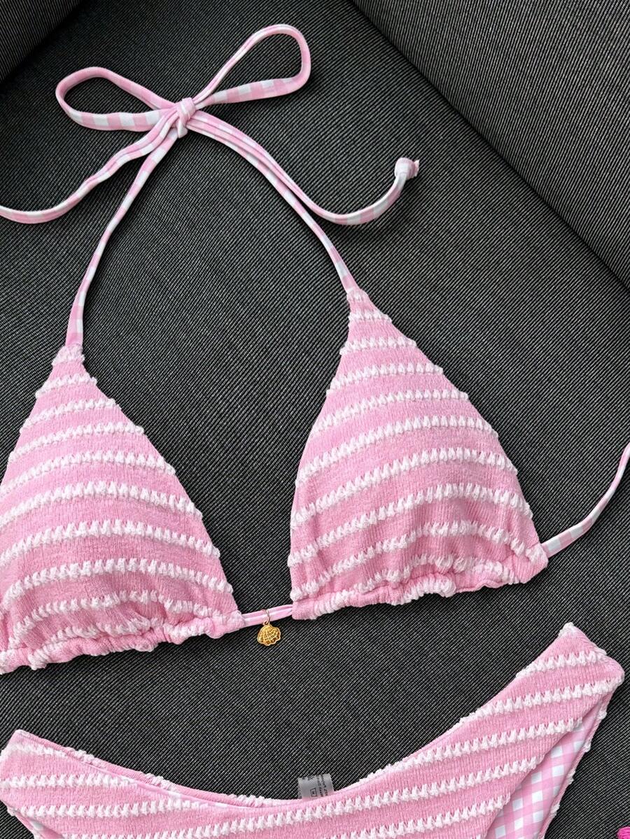 Women's black textured plaid 2-piece bikini set featuring a halter neckline, wireless triangle cups with removable padding, and mid-waist bottoms.