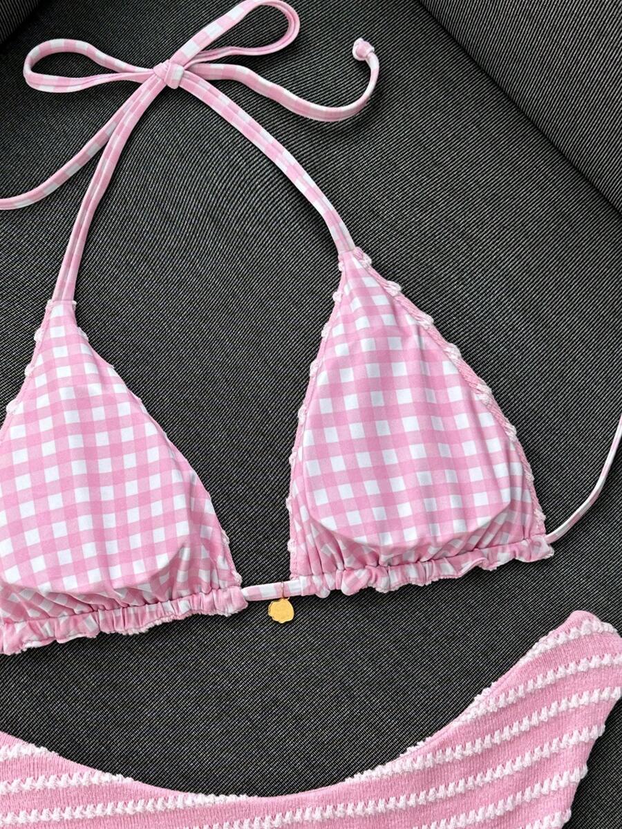 Women's black textured plaid 2-piece bikini set featuring a halter neckline, wireless triangle cups with removable padding, and mid-waist bottoms.