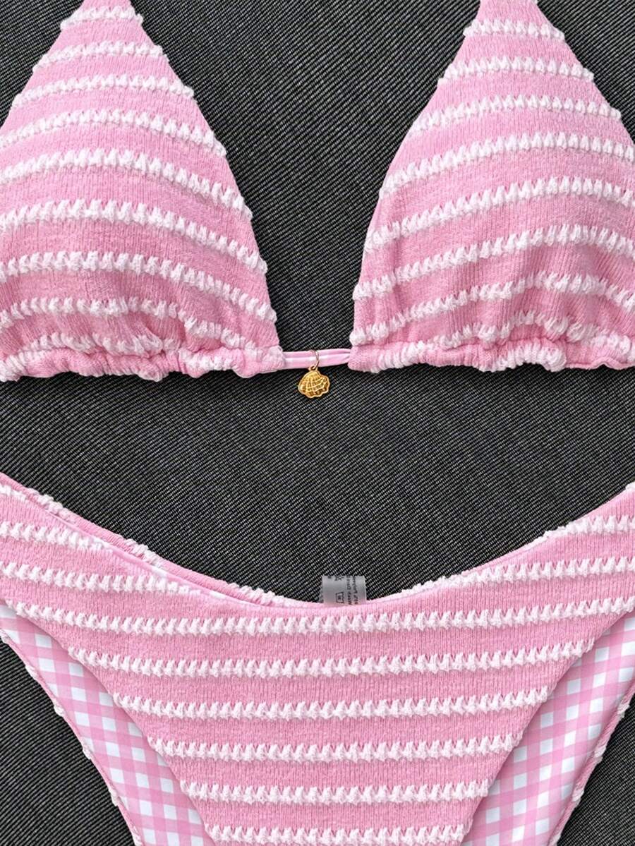 Women's black textured plaid 2-piece bikini set featuring a halter neckline, wireless triangle cups with removable padding, and mid-waist bottoms.