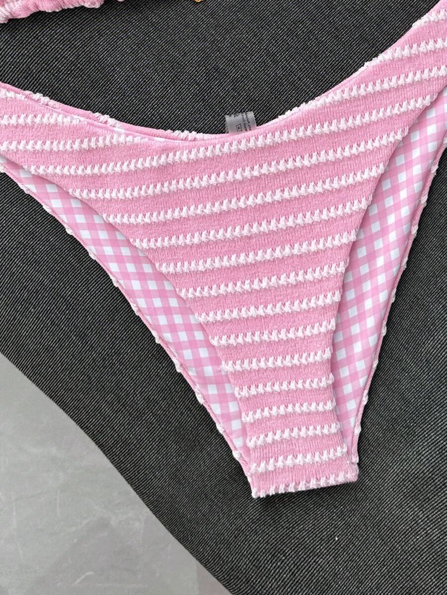 Women's black textured plaid 2-piece bikini set featuring a halter neckline, wireless triangle cups with removable padding, and mid-waist bottoms.