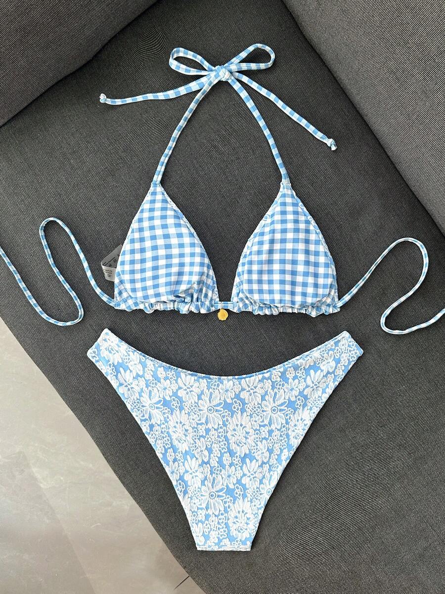 Women's black textured plaid 2-piece bikini set featuring a halter neckline, wireless triangle cups with removable padding, and mid-waist bottoms.