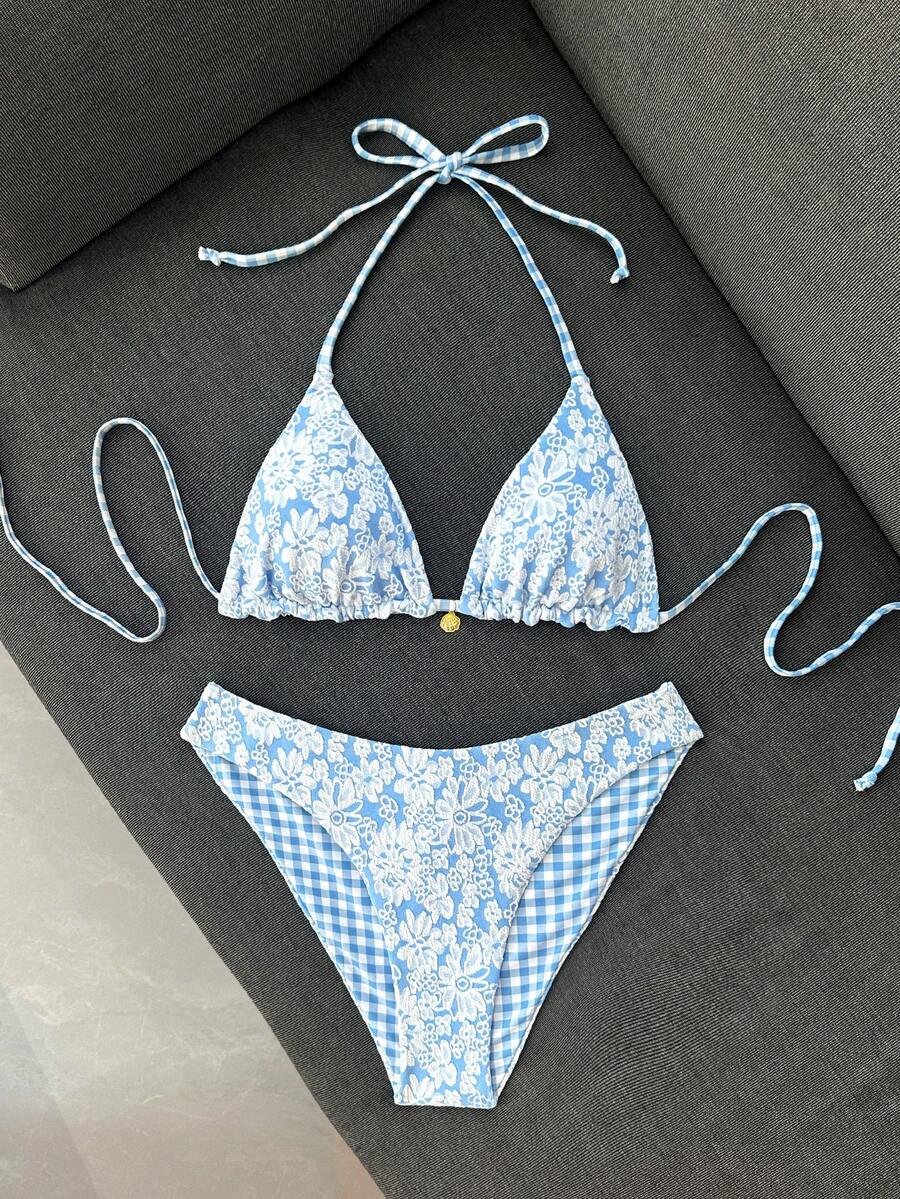 Women's black textured plaid 2-piece bikini set featuring a halter neckline, wireless triangle cups with removable padding, and mid-waist bottoms.