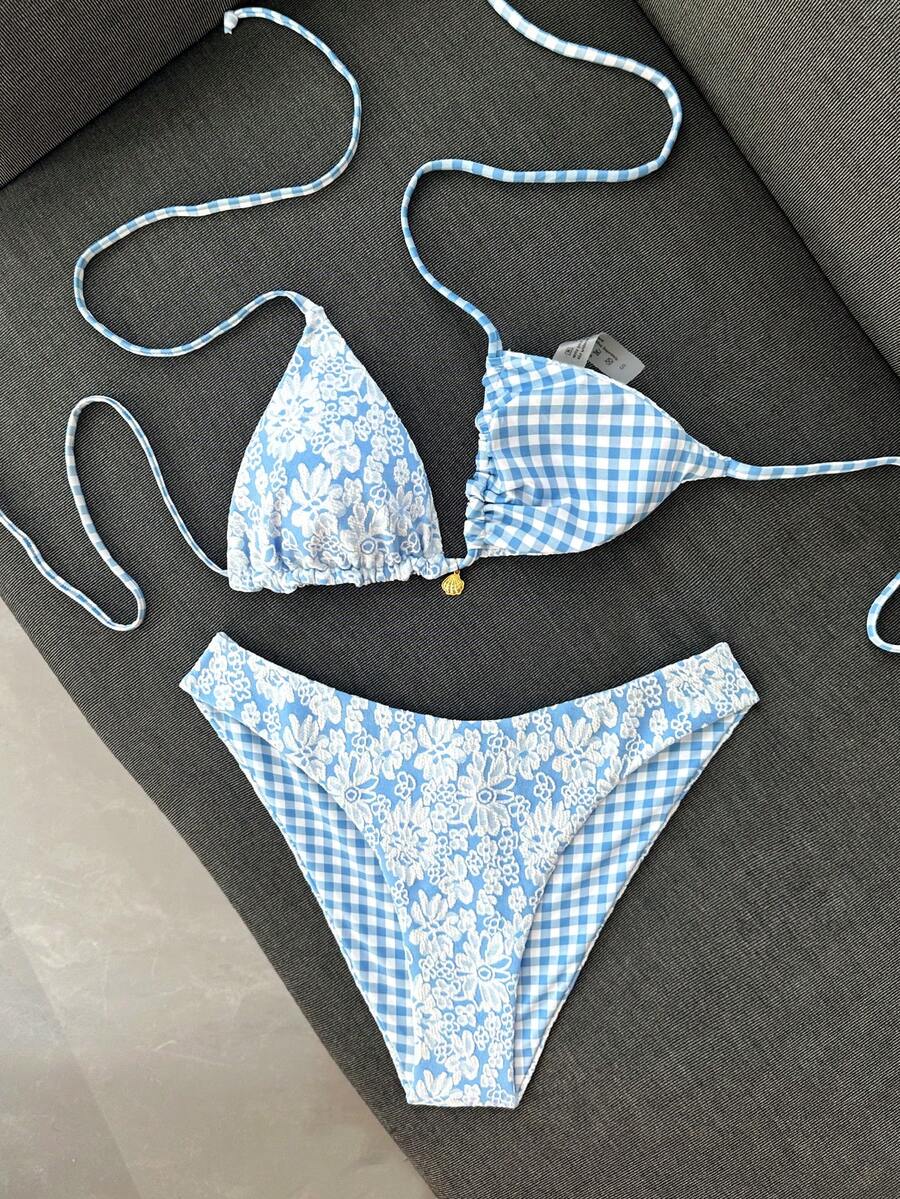 Women's black textured plaid 2-piece bikini set featuring a halter neckline, wireless triangle cups with removable padding, and mid-waist bottoms.