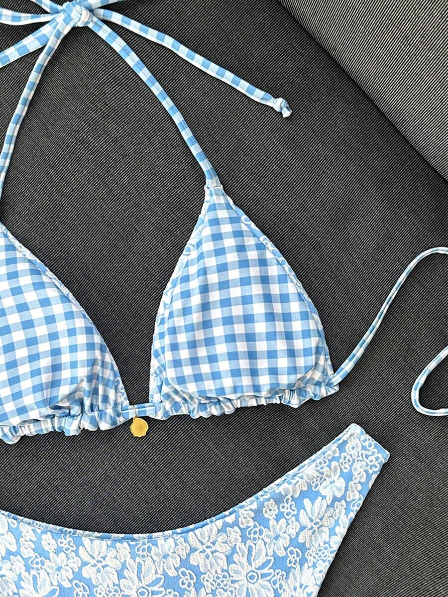 Women's black textured plaid 2-piece bikini set featuring a halter neckline, wireless triangle cups with removable padding, and mid-waist bottoms.