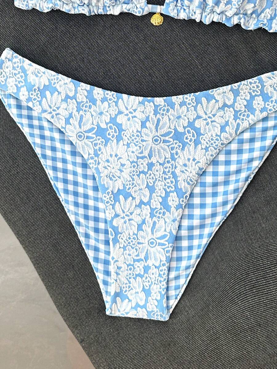 Women's black textured plaid 2-piece bikini set featuring a halter neckline, wireless triangle cups with removable padding, and mid-waist bottoms.