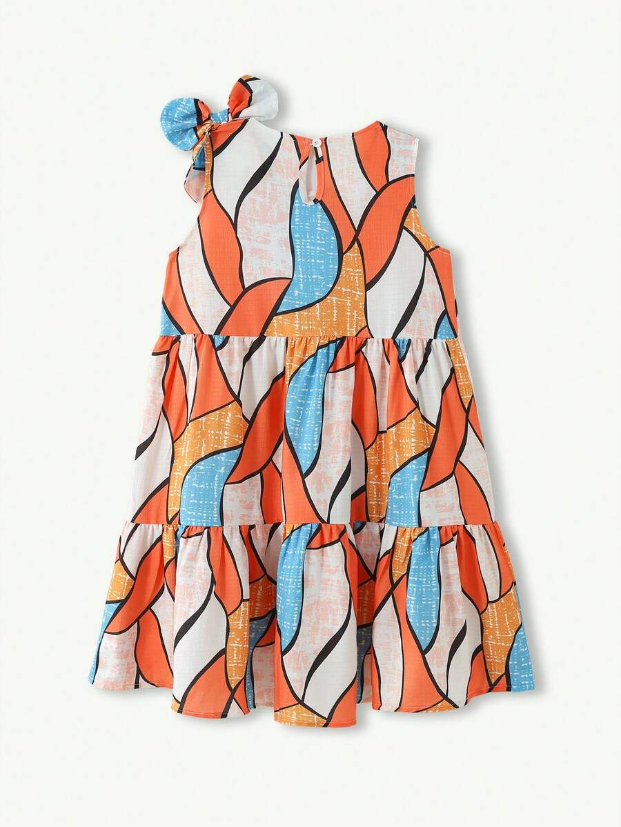 Tween girls blue striped sleeveless smock dress featuring a round neckline, high waist, and flounce ruffle hem.