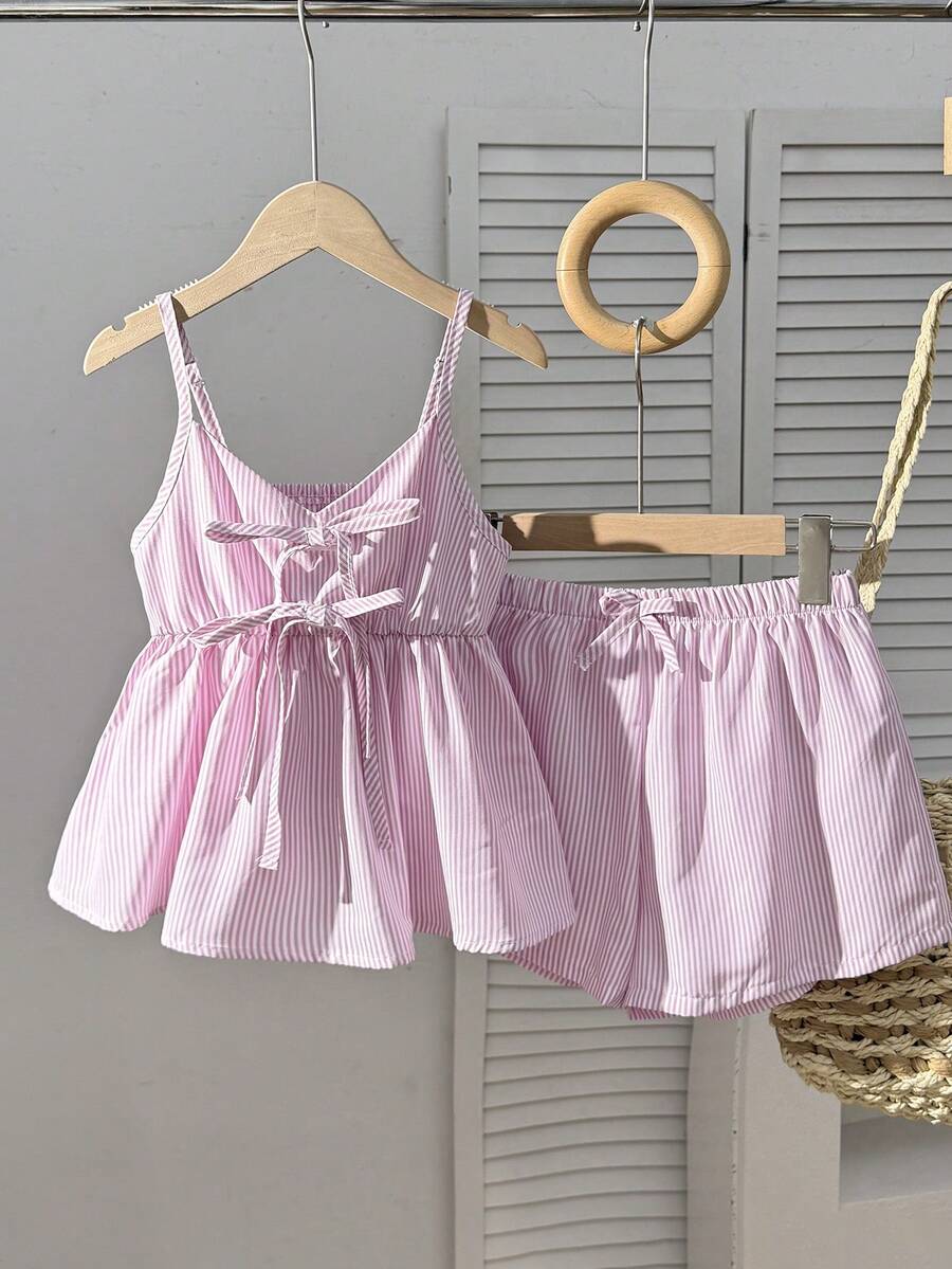 Tween girl 2-piece summer set with a black and white sleeveless striped spaghetti strap tank top with ruffle details and matching casual shorts.