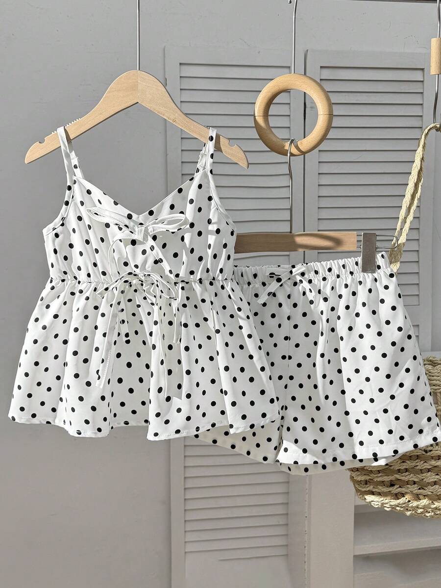 Tween girl 2-piece summer set with a black and white sleeveless striped spaghetti strap tank top with ruffle details and matching casual shorts.