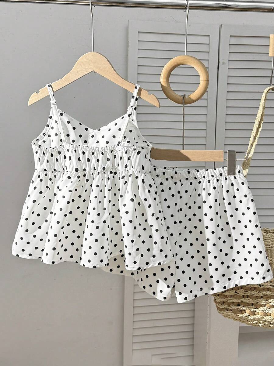 Tween girl 2-piece summer set with a black and white sleeveless striped spaghetti strap tank top with ruffle details and matching casual shorts.