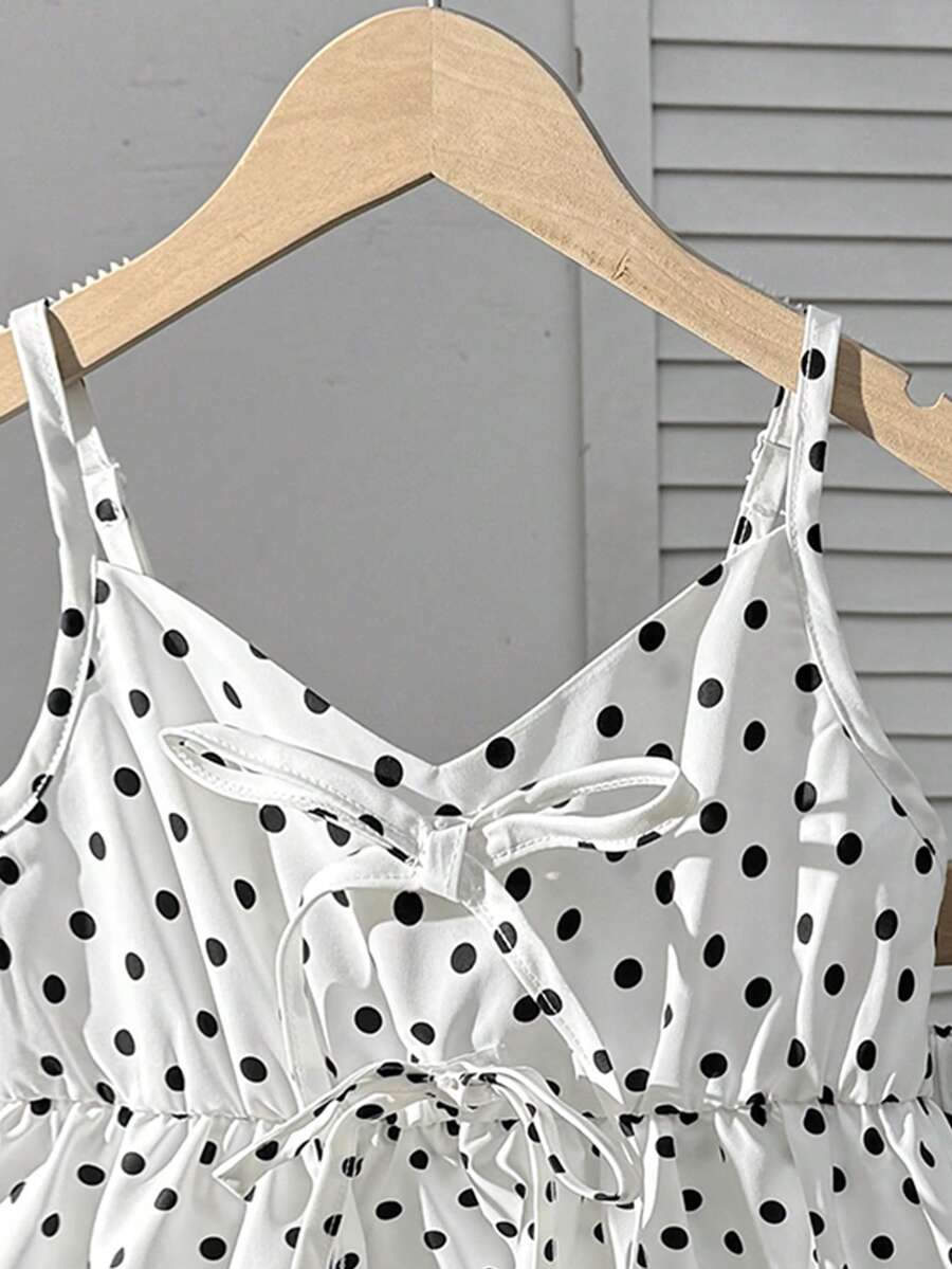 Tween girl 2-piece summer set with a black and white sleeveless striped spaghetti strap tank top with ruffle details and matching casual shorts.
